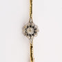 Golden entourage brooch with diamonds