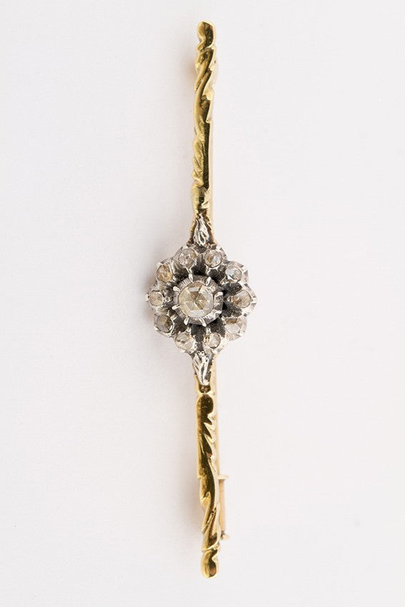 Golden entourage brooch with diamonds