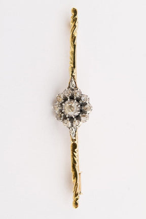 Golden entourage brooch with diamonds