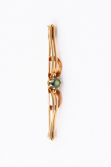 Gold brooch with green tourmaline