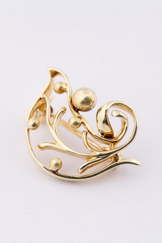 Golden bird brooch