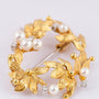 Gold brooch with diamonds and pearls