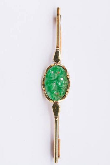 Golden brochette with jade