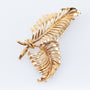 Gold feather brooch