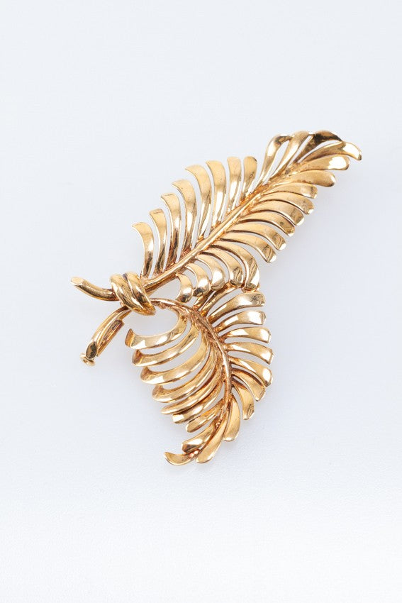 Gold feather brooch