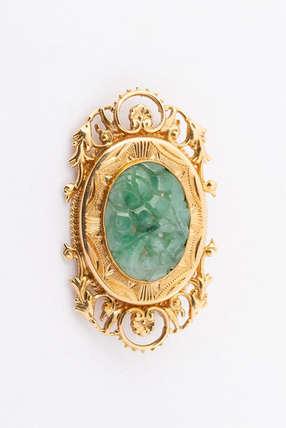 Gold brooch with jade