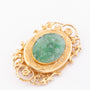 Gold brooch with jade