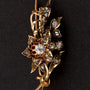Gold flower brooch with rose-cut diamonds set in silver