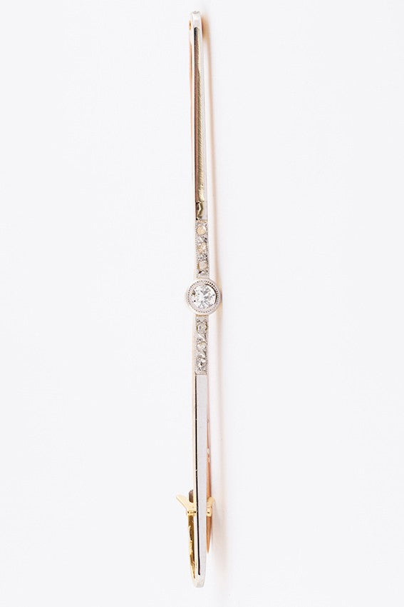 White/yellow gold brooch with a brilliant and rose cut diamond