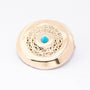 Antique gold brooch with turquoise