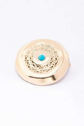 Antique gold brooch with turquoise
