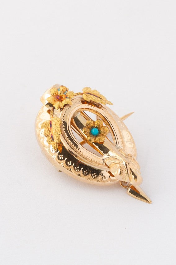 Antique gold brooch with turquoise