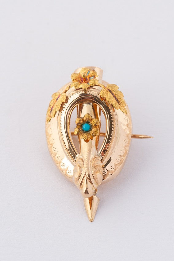 Antique gold brooch with turquoise