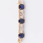 Antique gold brooch with blue spinel and brilliant