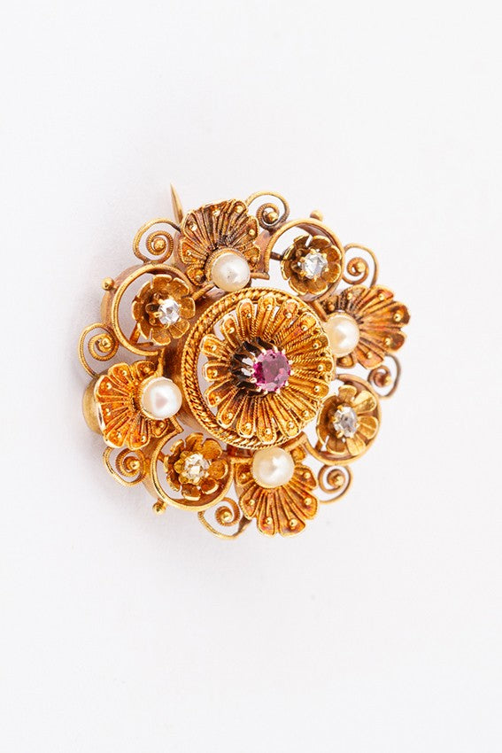 Antique gold brooch with spinel and diamonds