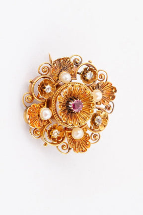 Antique gold brooch with spinel and diamonds