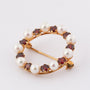 Gold openwork brooch with garnets and cultured pearls