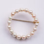 Gold openwork brooch with cultured pearls