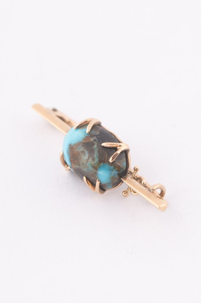 Antique gold brooch with turquoise