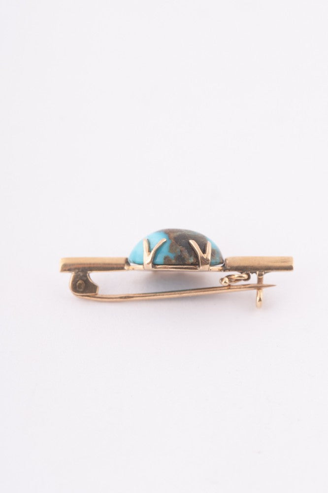 Antique gold brooch with turquoise