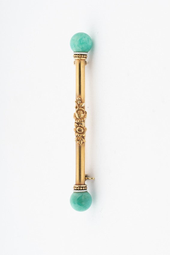 Gold brochette with amazonite and white enamel
