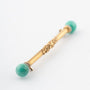 Gold brochette with amazonite and white enamel