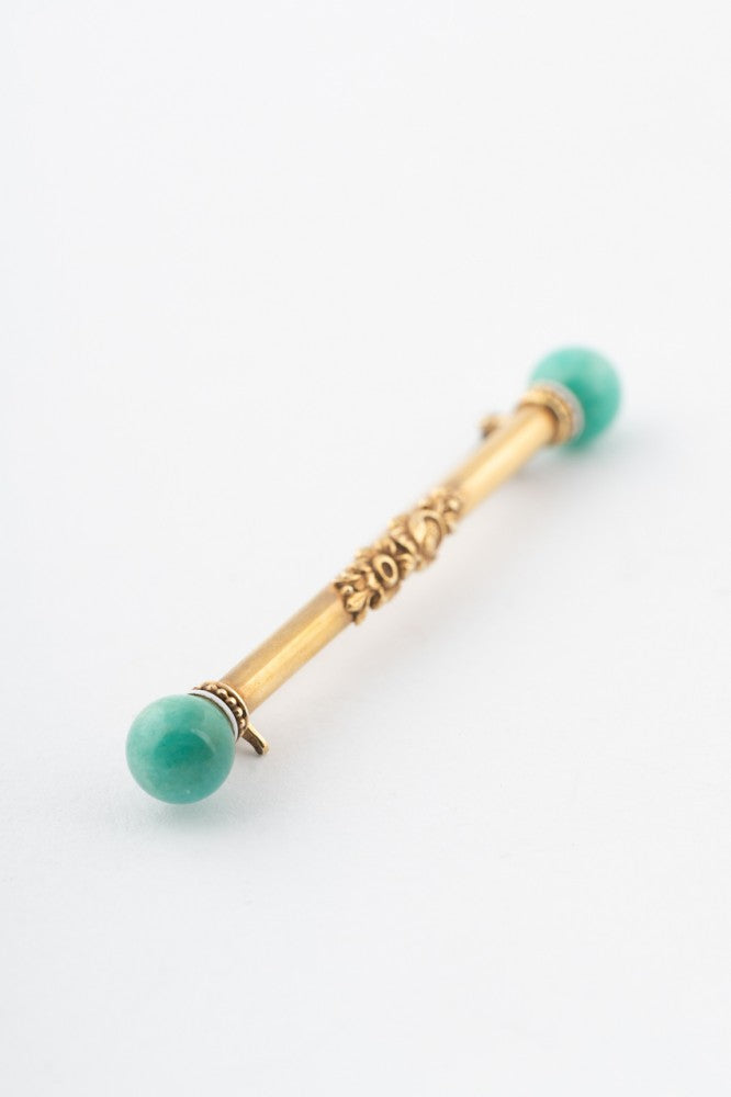 Gold brochette with amazonite and white enamel