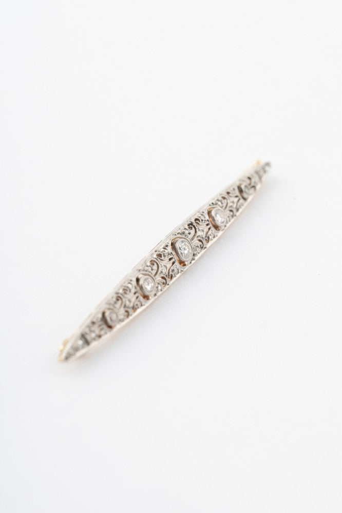 White/yellow gold brooch with 5 brilliant-cut diamonds and rose-cut diamonds