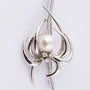White gold brooch with cultured pearl and 3 brilliant-cut diamonds