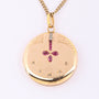 Antiek gouden medaillon met diamant en robijn