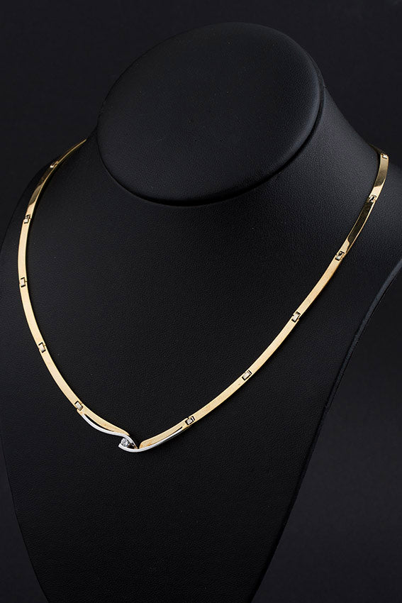 Wit/geel gouden schakel collier met een briljant