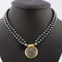 Hematiet collier aan gouden sluiting met antieke grieks/romeinse munt