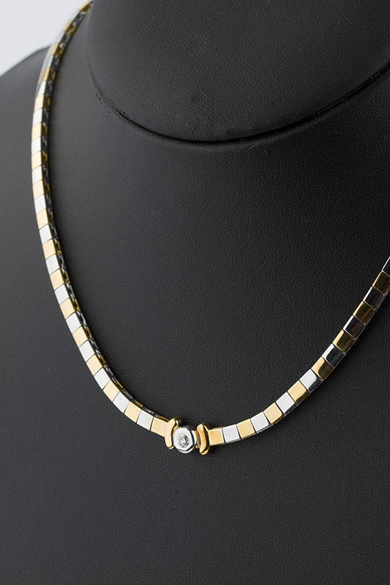 White/yellow gold necklace with a brilliant
