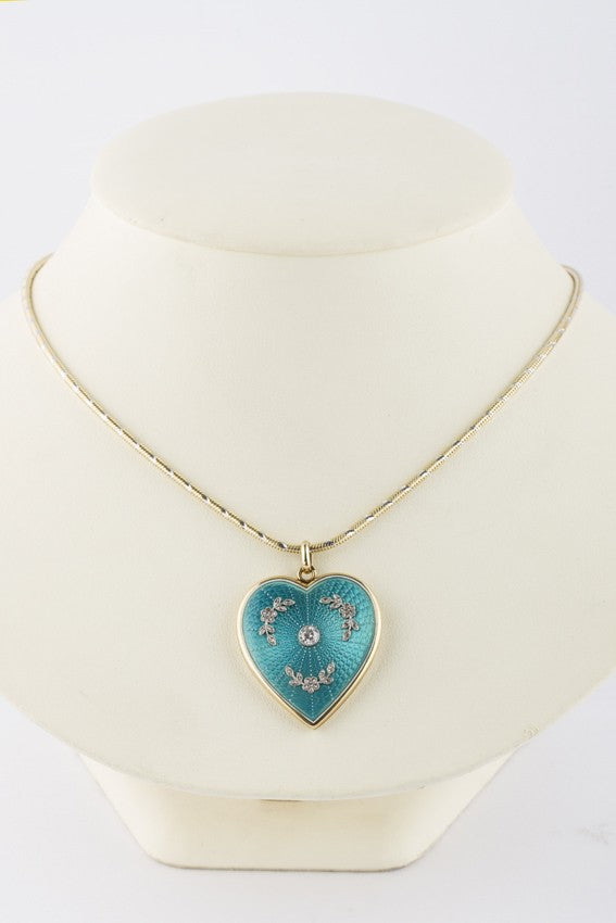 Gouden hart medaillon met briljant en diamant