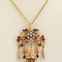 Antieke 18 krt. gouden hanger met granaten en parels