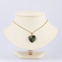 Moss agate heart pendant on gold necklace
