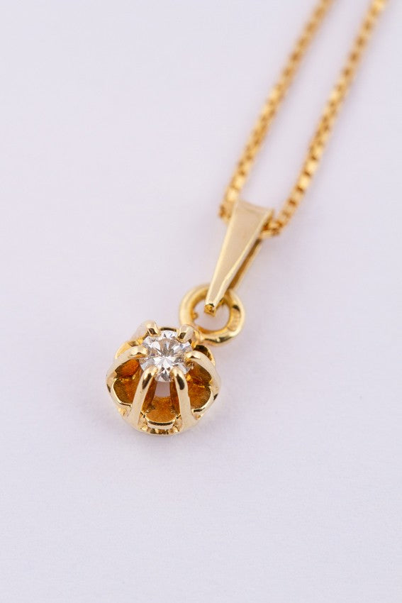 Gouden solitair hanger met een briljant