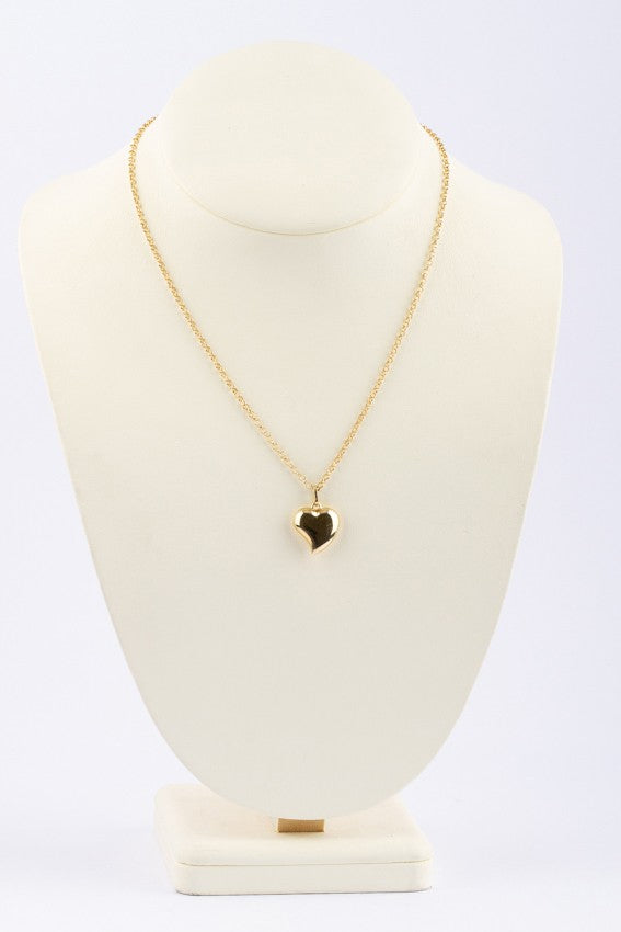 Gouden hart hanger aan gouden collier