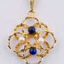 Gold pendant with lapis lazuli and pearls on a gold necklace