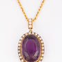 Gold entourage pendant with pearls and amethyst on a cord necklace