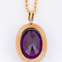 Gold entourage pendant with pearls and amethyst on a cord necklace