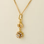 Gold entourage pendant with diamonds on a gold necklace