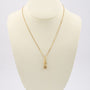 Gold entourage pendant with diamonds on a gold necklace