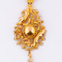 Gold traditional costume pendant on gold necklace
