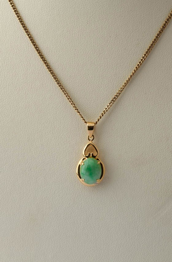 18 krt. gouden hanger met jade aan collier