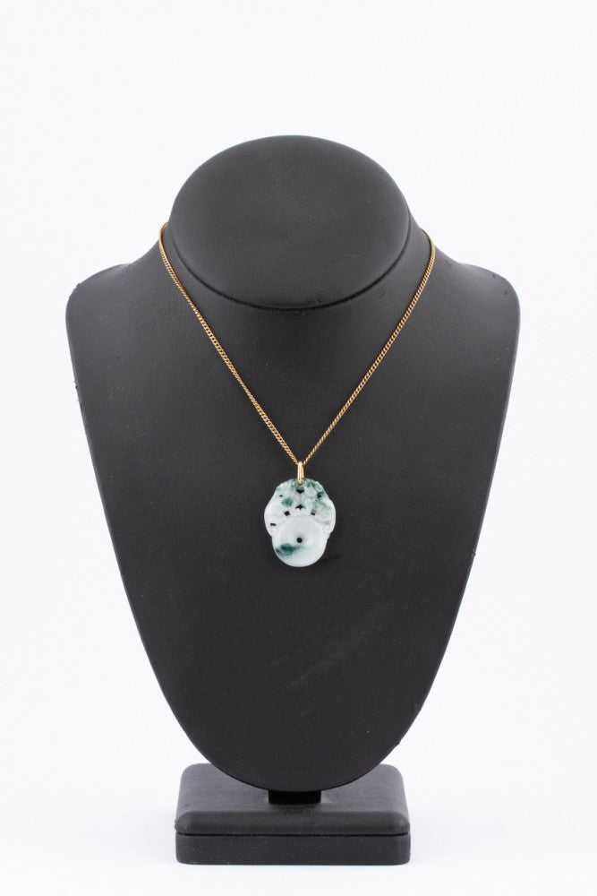 Jade lucky pendant with two monkeys on a gold necklace