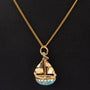 Gouden hanger zeilbootje met turkoois aan gouden collier