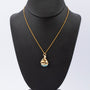 Gouden hanger zeilbootje met turkoois aan gouden collier