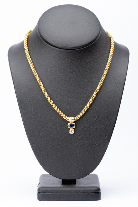 Gouden collier met een hanger met saffier en briljant (Fope)