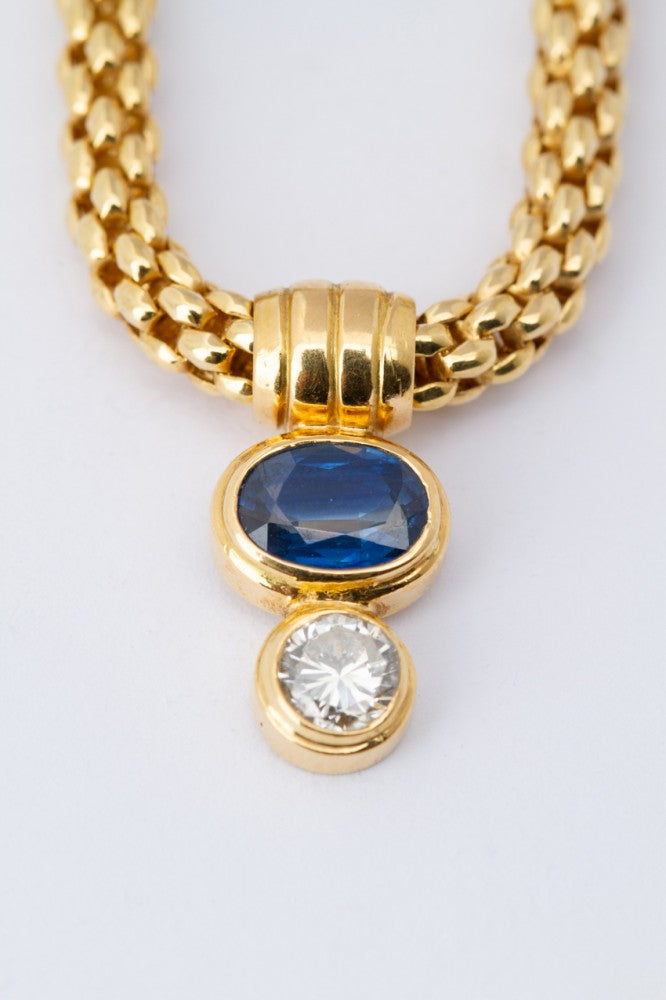 Gouden collier met een hanger met saffier en briljant (Fope)